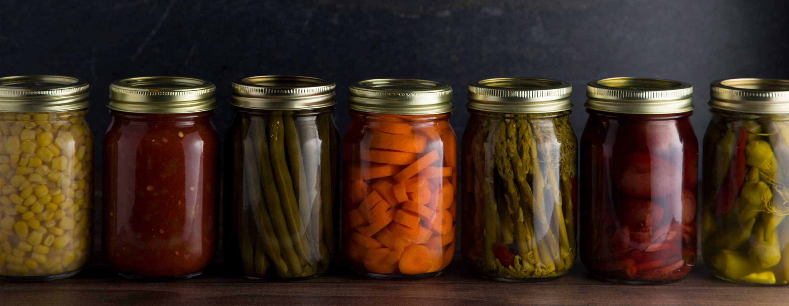 Preserving organic vegetables in jars  for winter. Jar Stock Photo