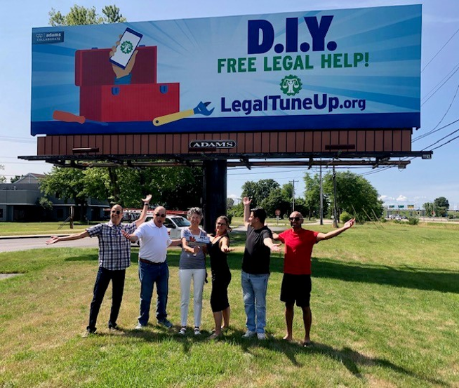 DIY Free Legal Help! Billboard with adults standing in front