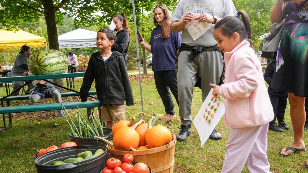 Children doing a scavenger hunt at the farmers market.